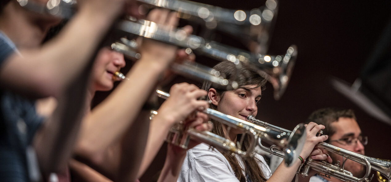 A group of students playing brass instruments at a music summer camp in Orono Maine