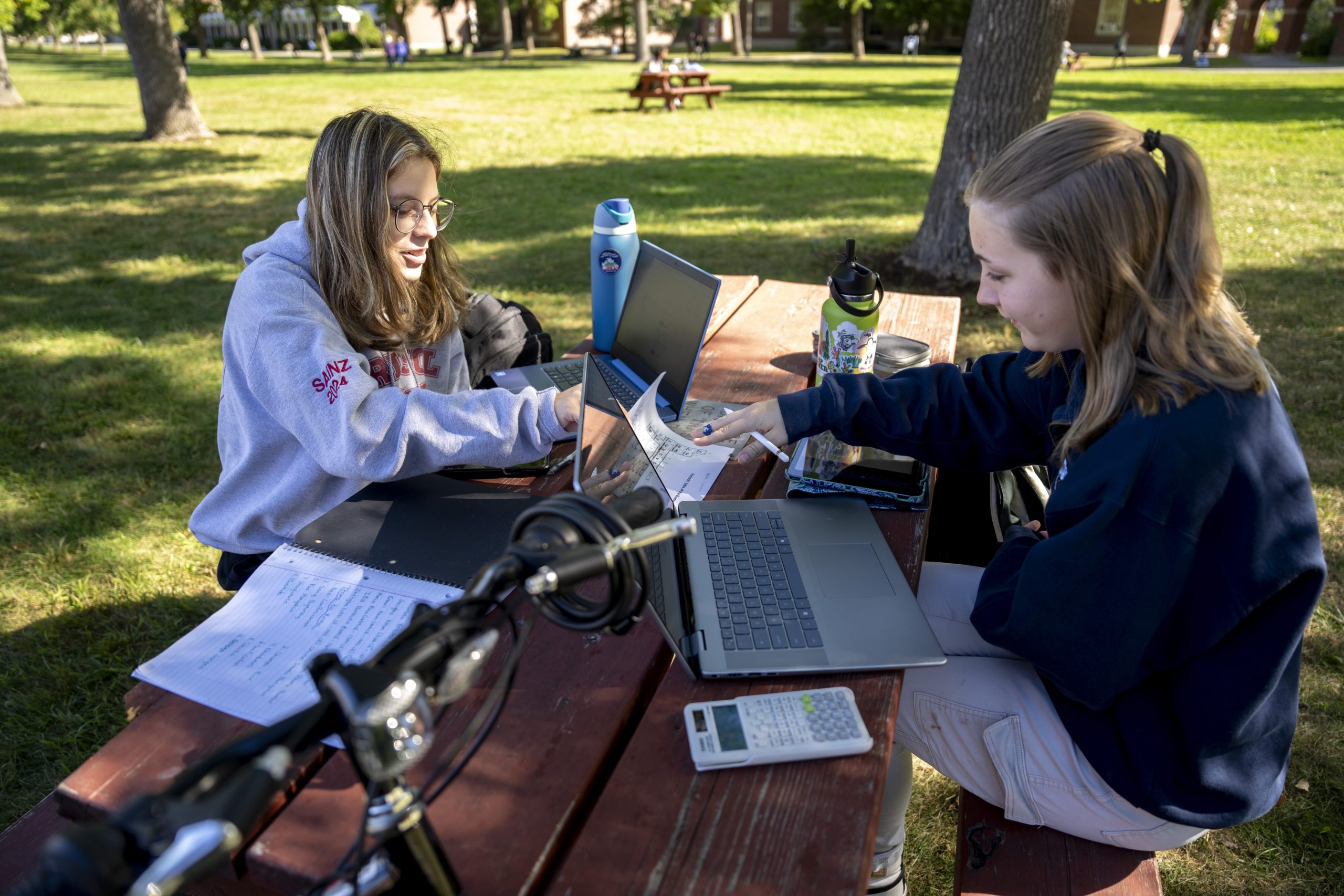 Students study on the mall on a crisp summer morning.