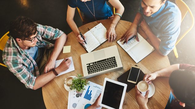 Group of people working at a table