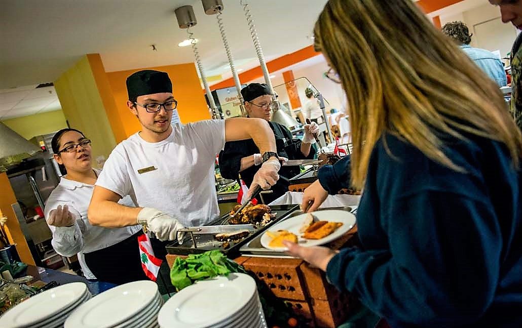 A student is being served in a UMaine dining commons