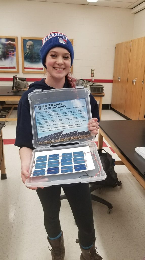Student shows off her homemade solar cellphone charger