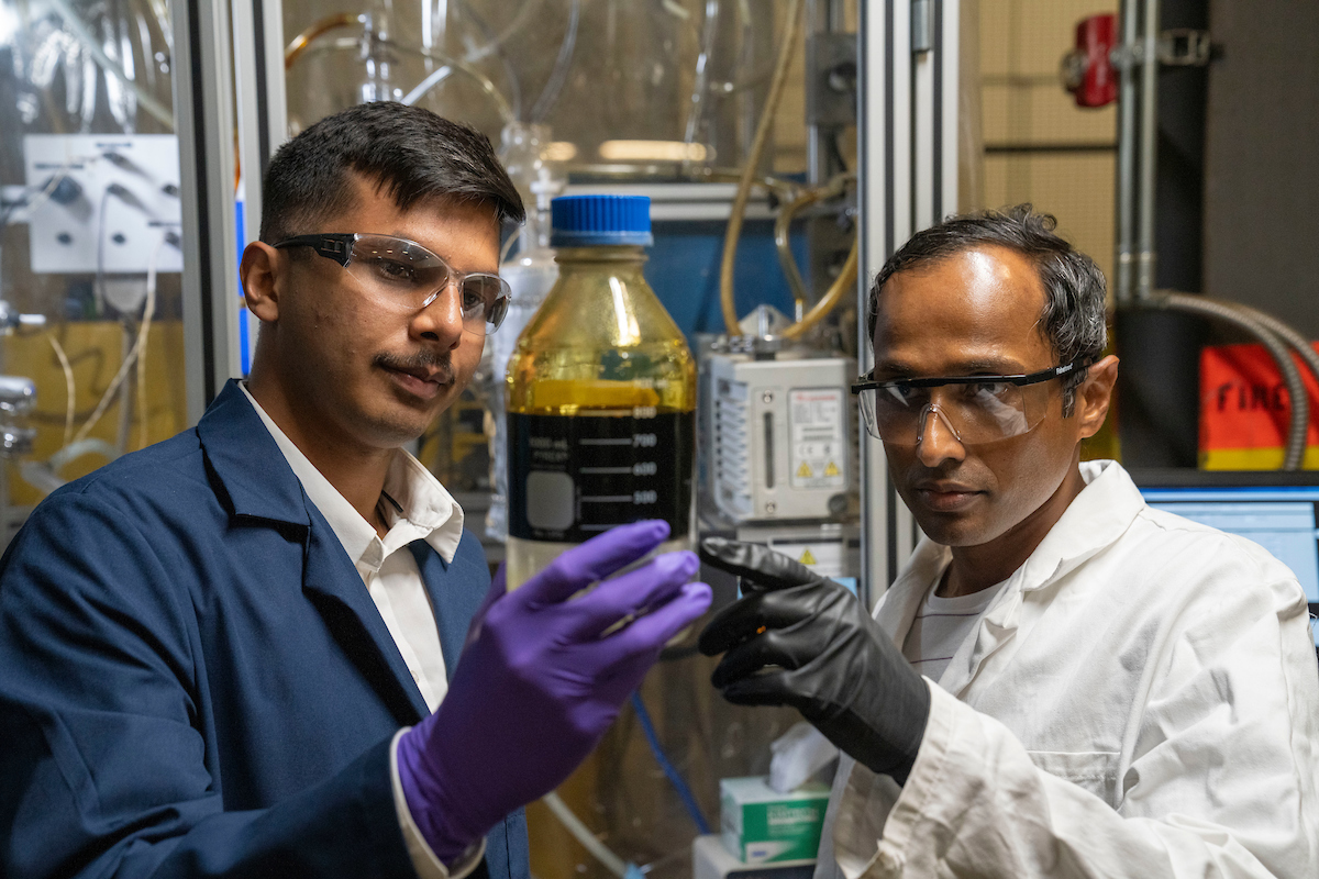 Two scientist working as part of the TRC/Forest Bioproducts lab
