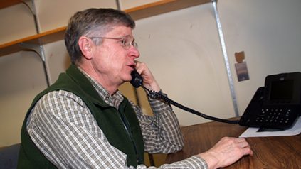 image of Bill answering the phone
