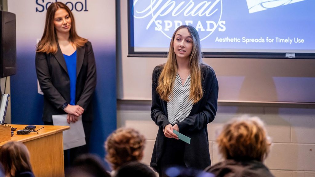 A photo of a person giving a presentation.