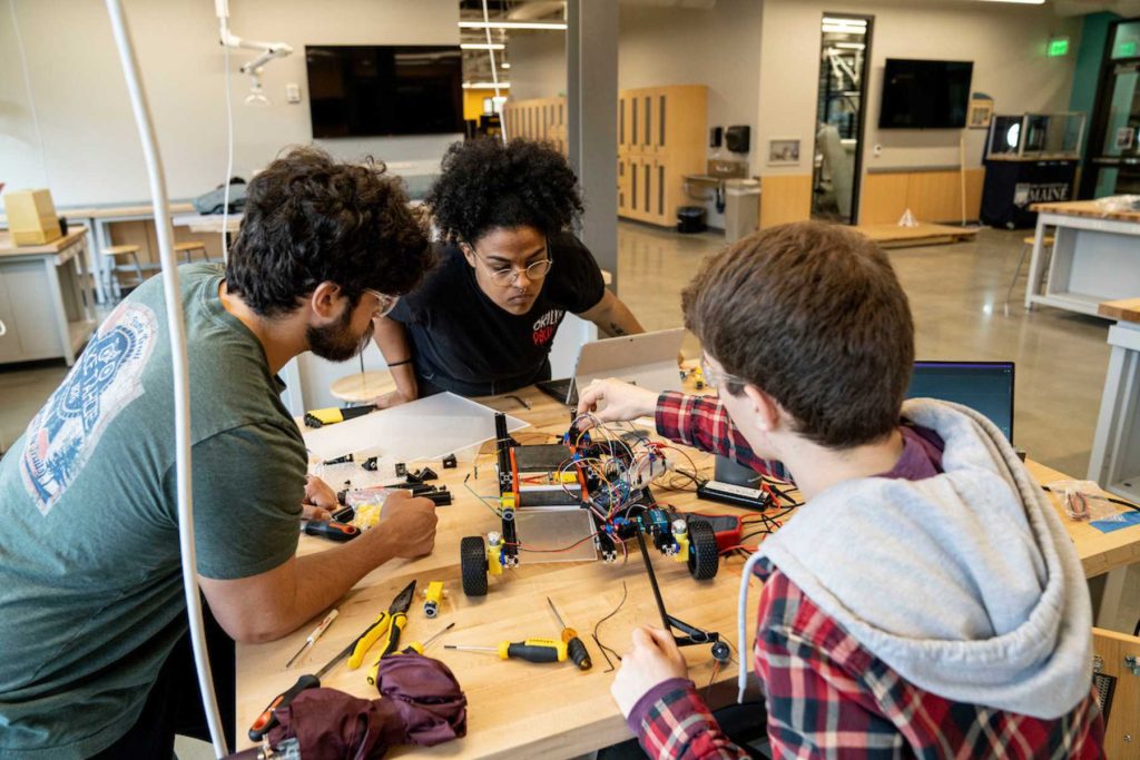 Engineering students working in a lab setting