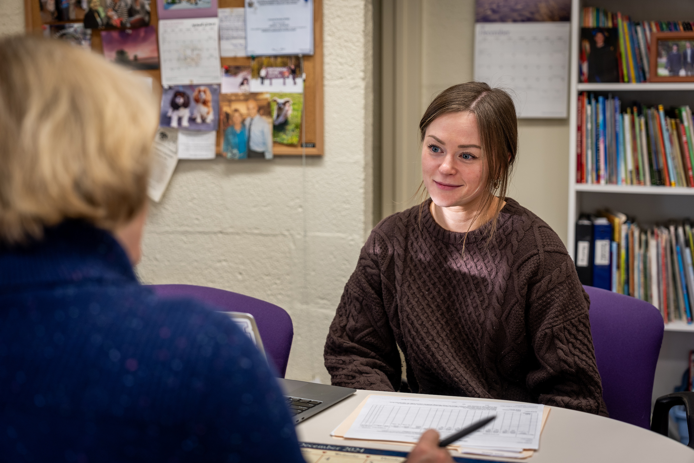 Student talking to faculty memeber