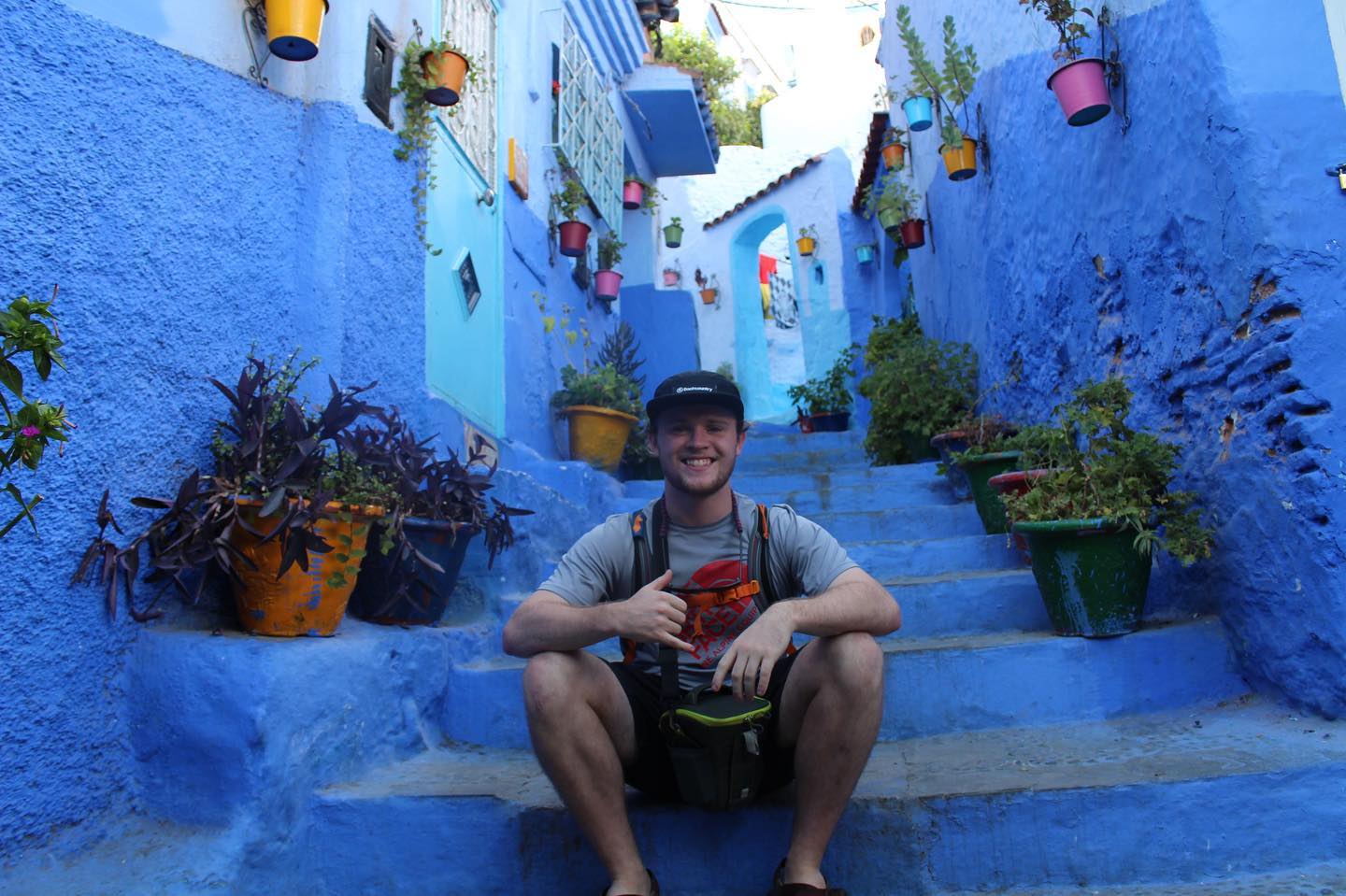 Student sitting on steps in Spain