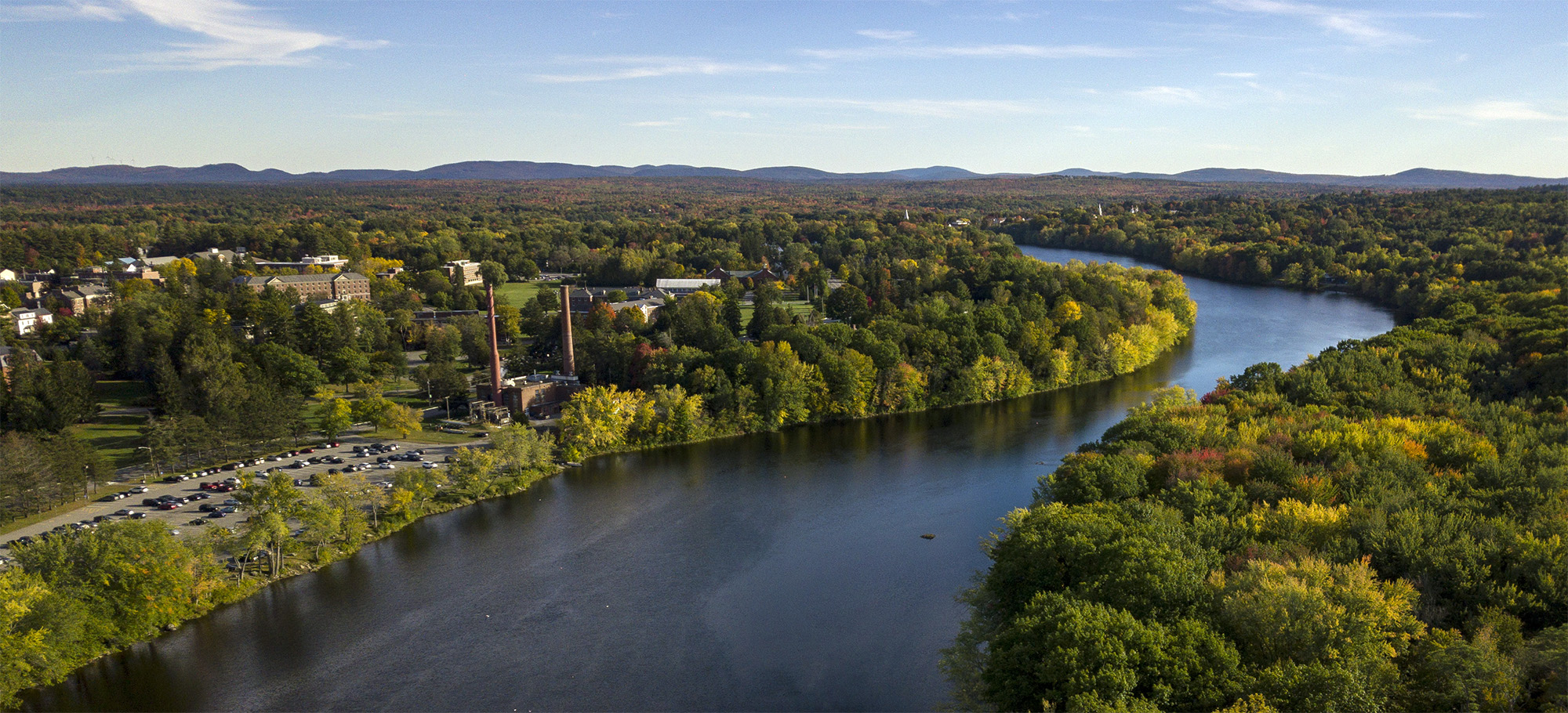 An aerial photo of the Stillwater River and the University of Maine steam plant