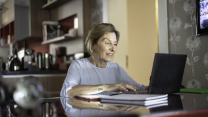 Mature woman working at home