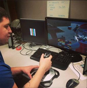 Scott Richards working on his virtual toy box simulation where the objective is to protect the toy box from invading toys