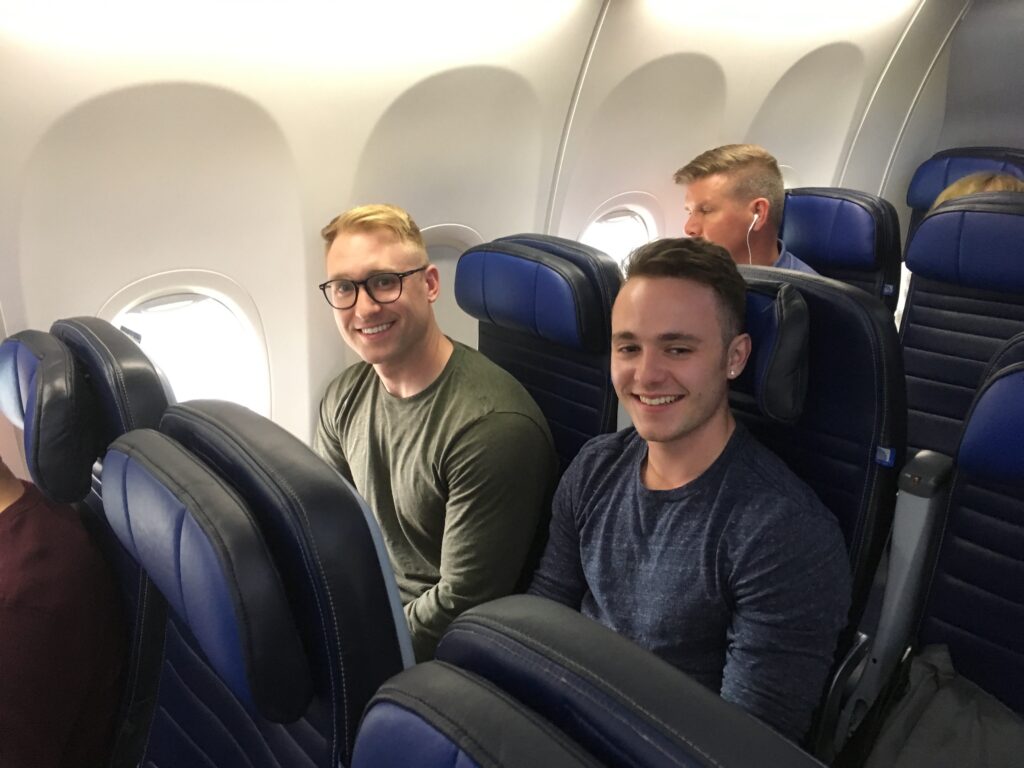 Two tutors on a plane to a Colorado Writing Center Conference