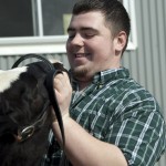 Student with cow at Witter Center