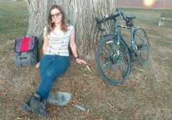 Meija in front of a tree