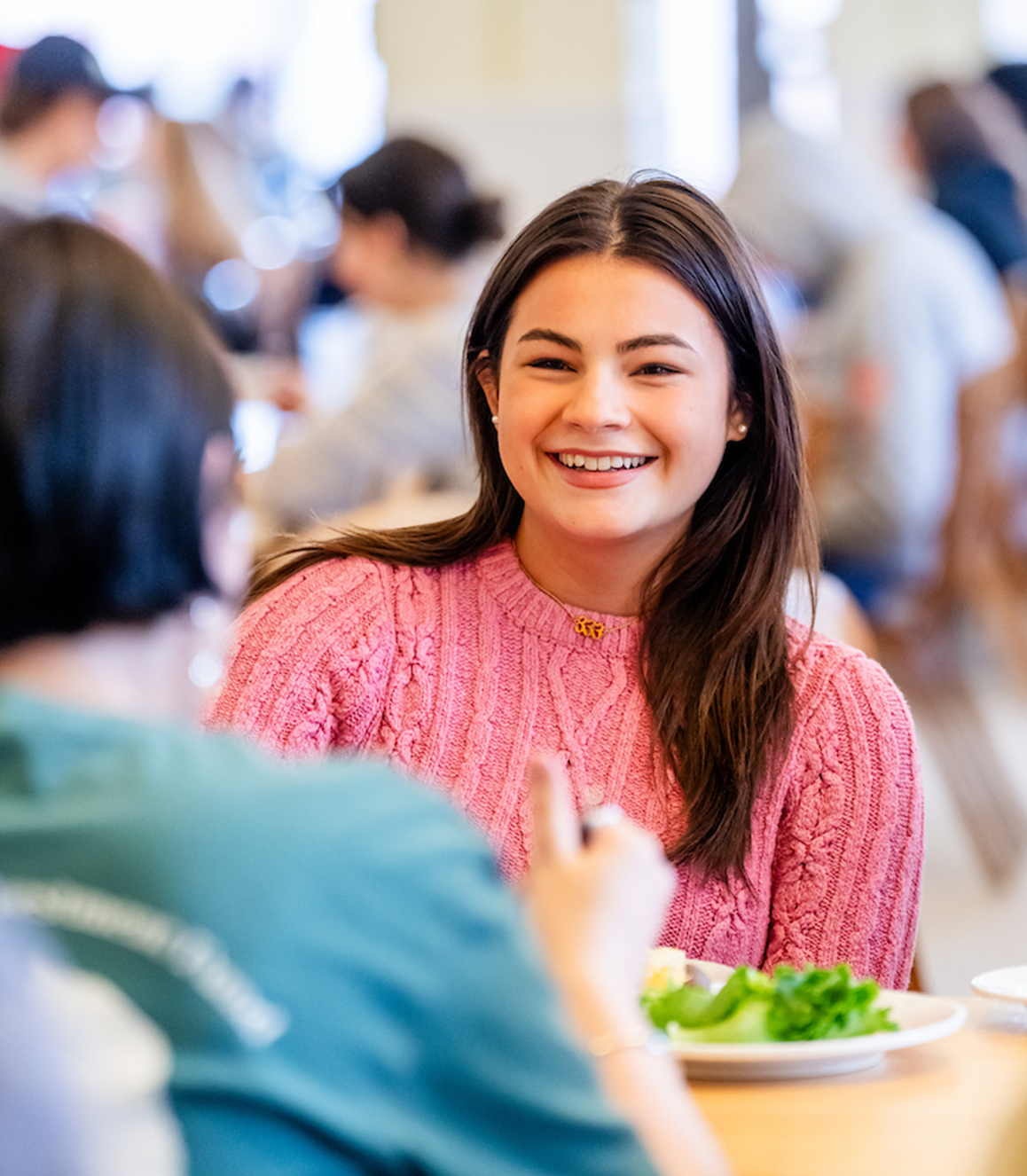 A photo of a student in a dining hall