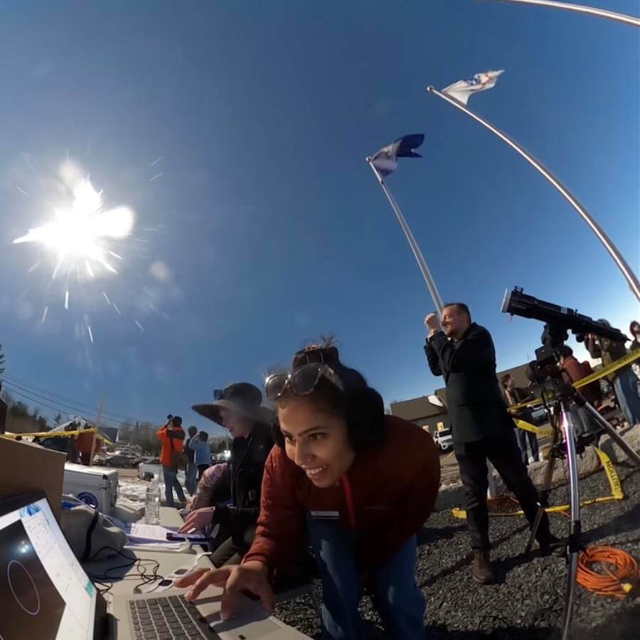 A photo of a scientist on a laptop