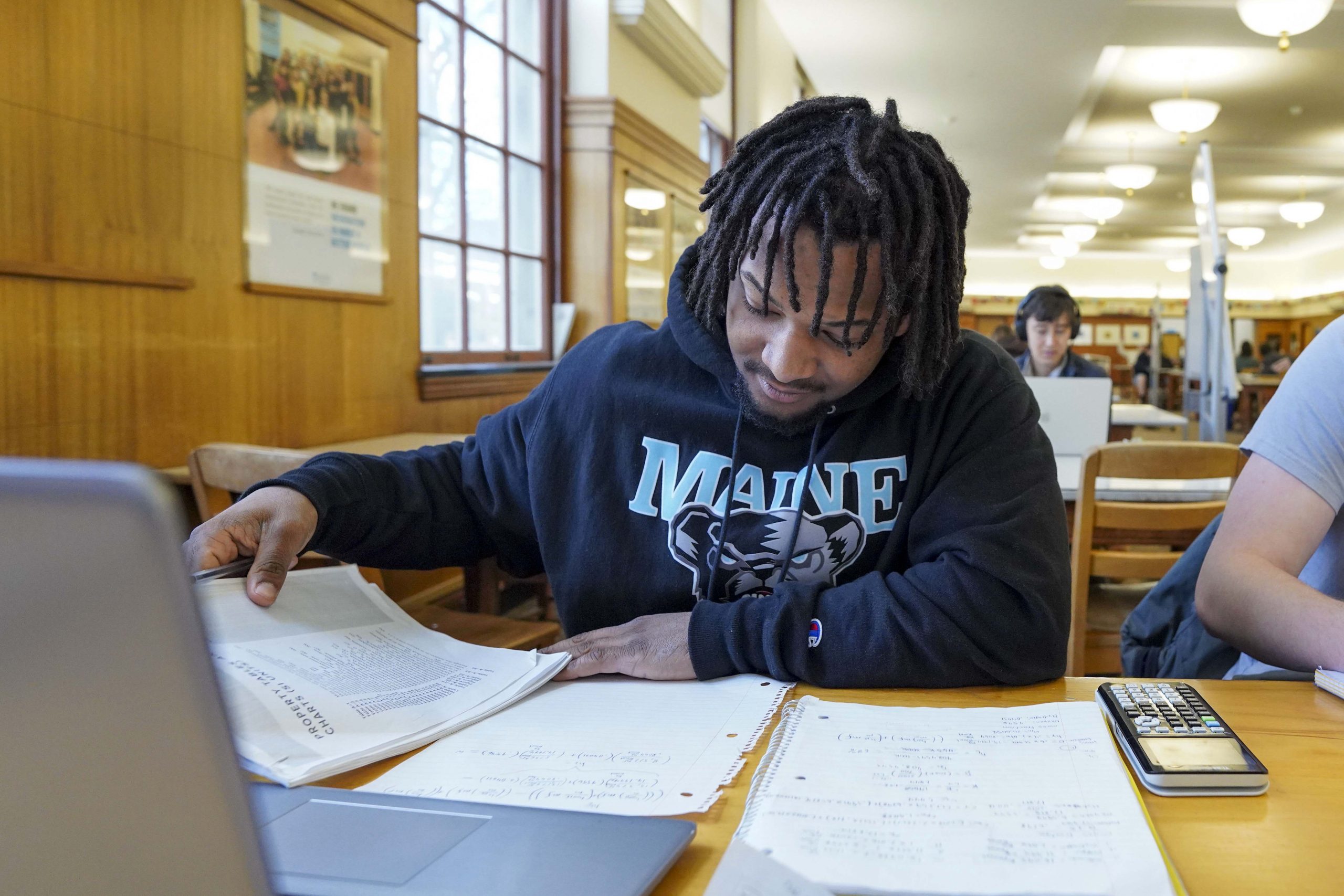 A photo of a student studying in Fogler Library