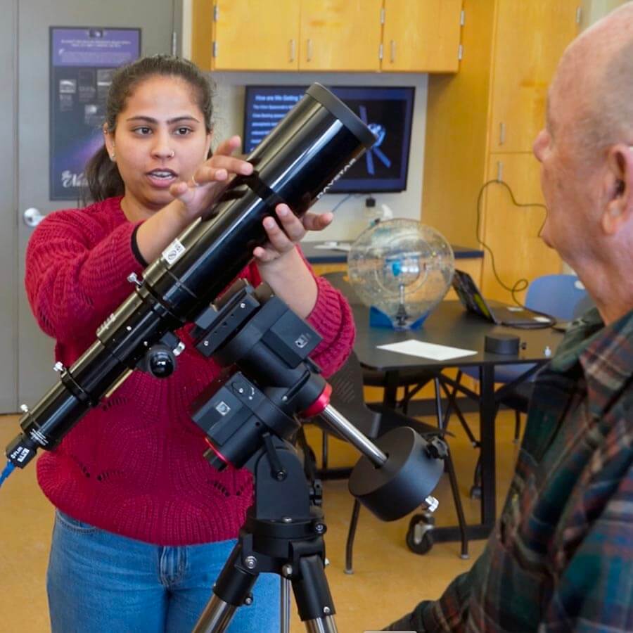 A photo of someone with a telescope