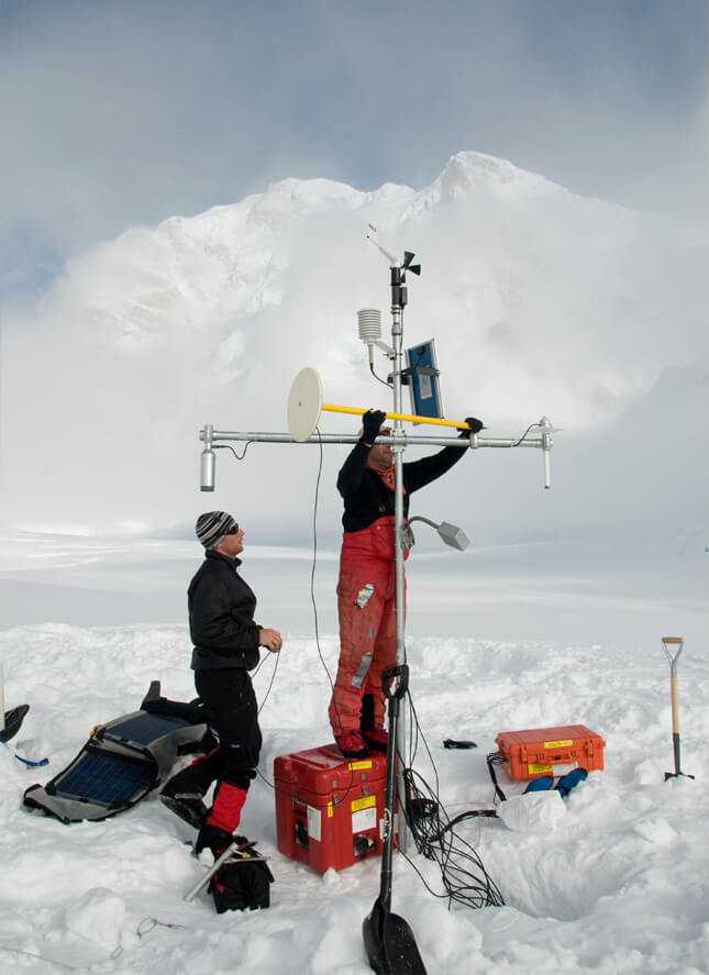 Scientists in the field with equipment