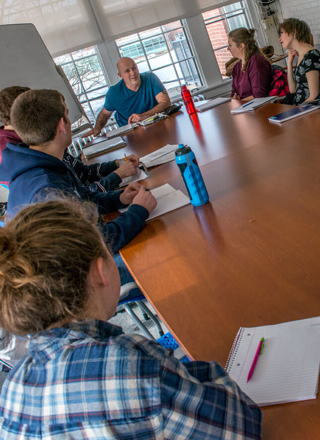 Honors College students sitting around a table