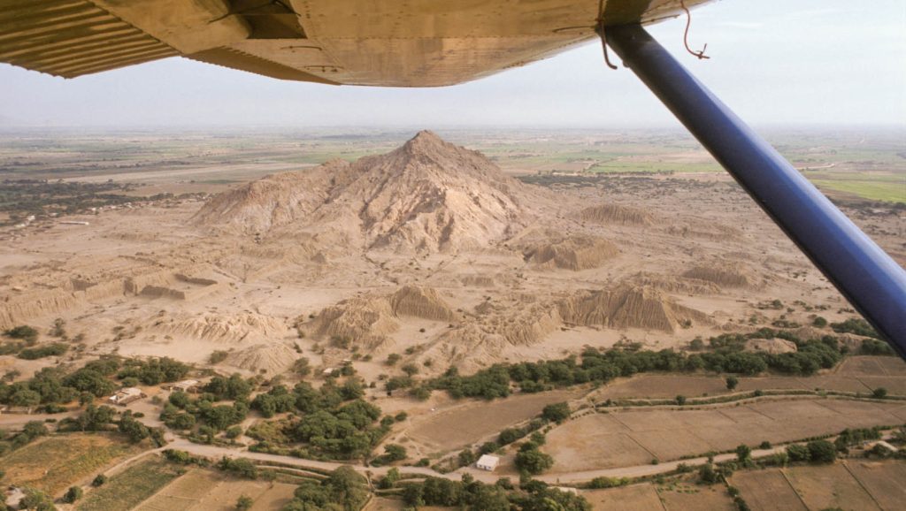 An aerial photo of a pyramid center in Peru