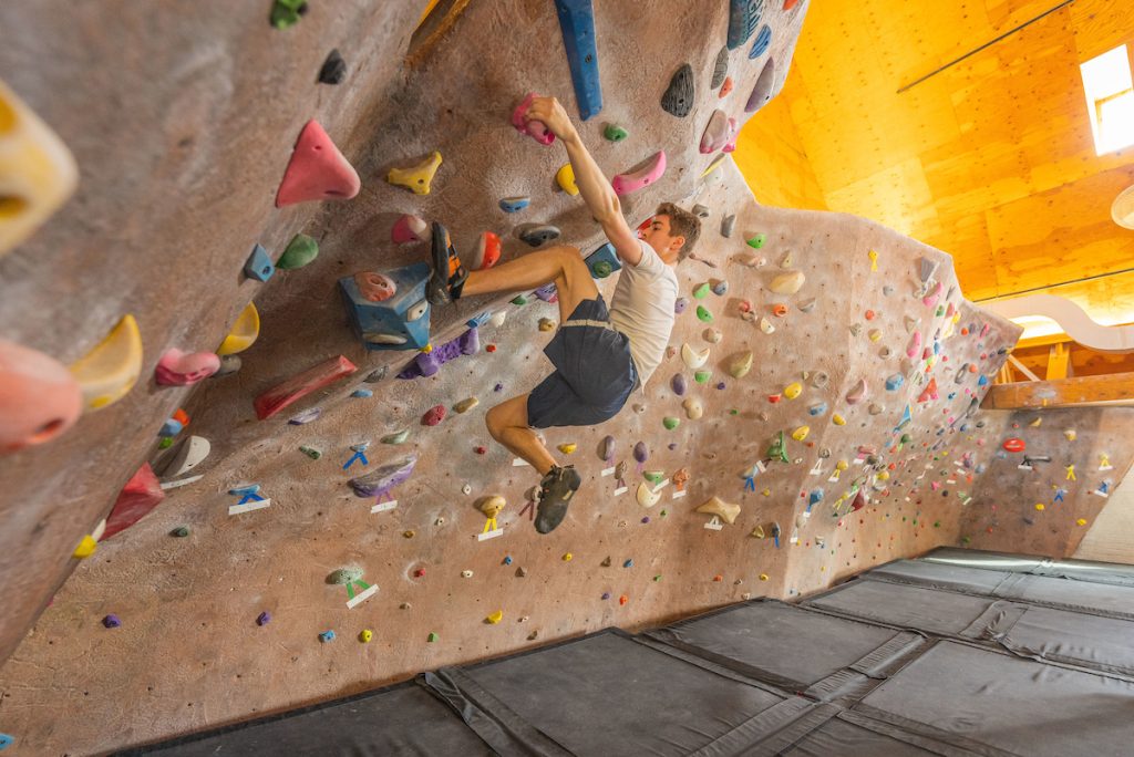 A photo of a student rock climbing