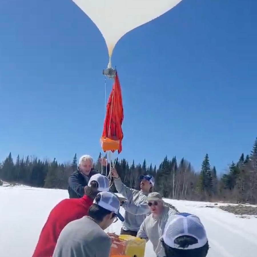 A photo of the high altitude balloon being launched from the ground