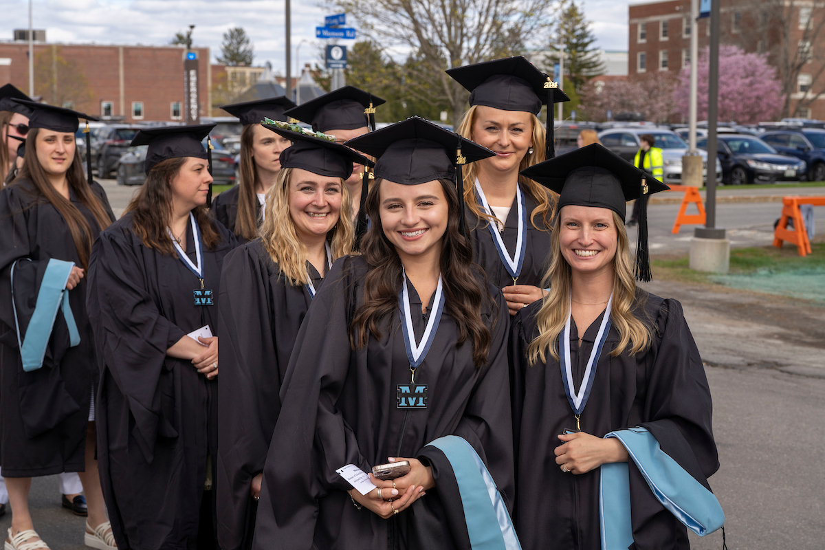 A photo of graduate students at commencement