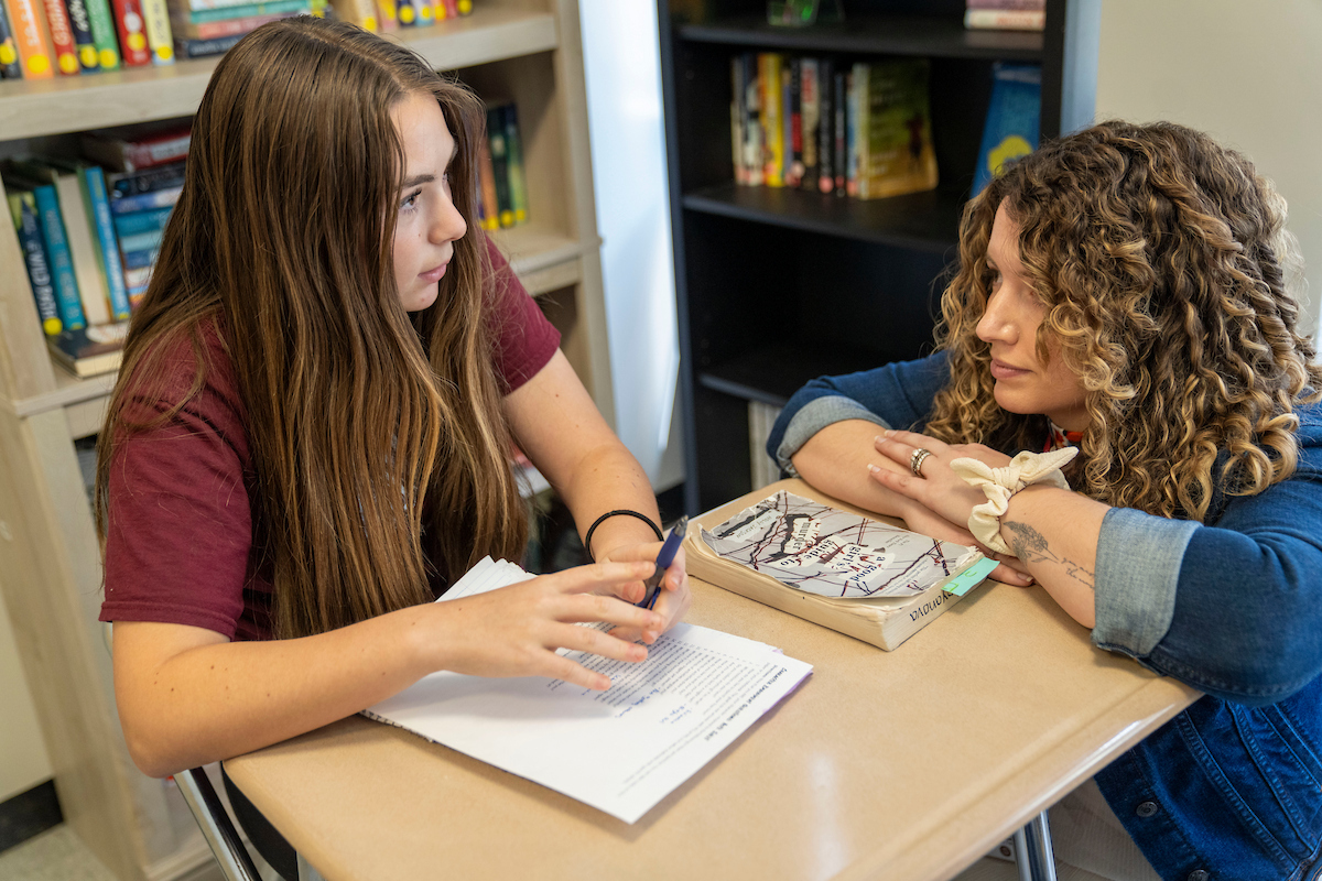 A photo of a student teacher with a student