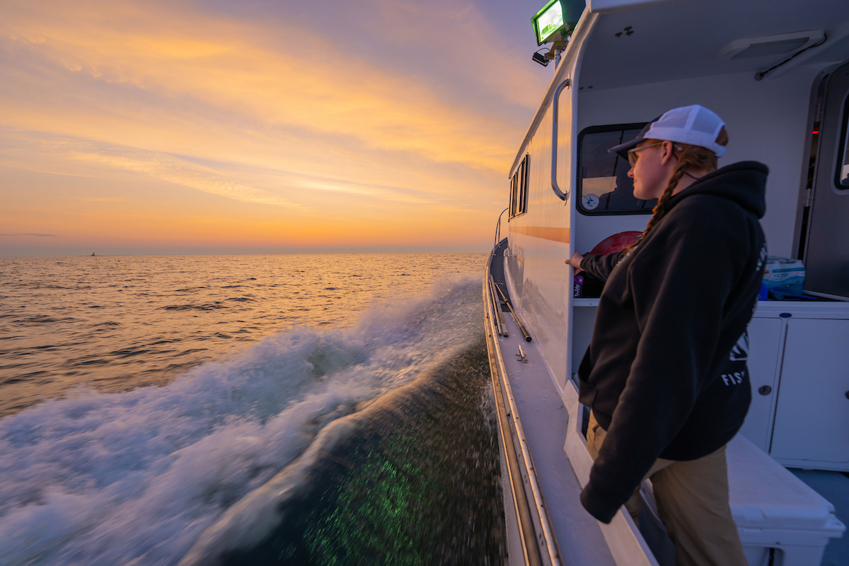 A photo of a student on a boat